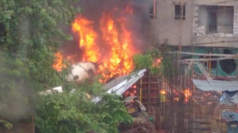 Five people, four crew members including two pilots and a pedestrian, lost their lives when the 12-seater plane on a test flight crashed into an under-construction building on Thursday. (Photo: Shripad Naik) Five people, four crew members including two pilots and a pedestrian, lost their lives when the 12-seater plane on a test flight crashed into an under-construction building on Thursday. (Photo: Shripad Naik)