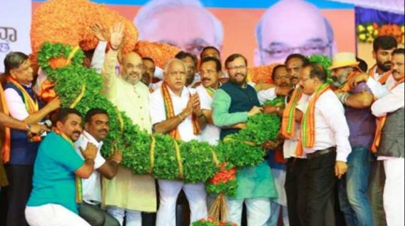 Amit Shah’s rally as part of the 'Parivarthana Yatra' by the state BJP came amid the bandh called by pro-Kannada outfits seeking PM Modi’s intervention on the Mahadayi water sharing issue. (Photo: Twitter/@AmitShah) Amit Shah’s rally as part of the 'Parivarthana Yatra' by the state BJP came amid the bandh called by pro-Kannada outfits seeking PM Modi’s intervention on the Mahadayi water sharing issue. (Photo: Twitter/@AmitShah)