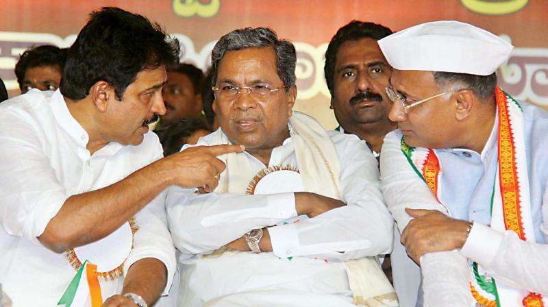 KPCC’s newly-appointed president Dinesh Gundu Rao (R) with former chief minister Siddaramaiah (C) and AICC general secretary, incharge of Karnataka, K.C. Venugopal in Bengaluru on Wednesday. (Photo:DC) KPCC’s newly-appointed president Dinesh Gundu Rao (R) with former chief minister Siddaramaiah (C) and AICC general secretary, incharge of Karnataka, K.C. Venugopal in Bengaluru on Wednesday. (Photo:DC)