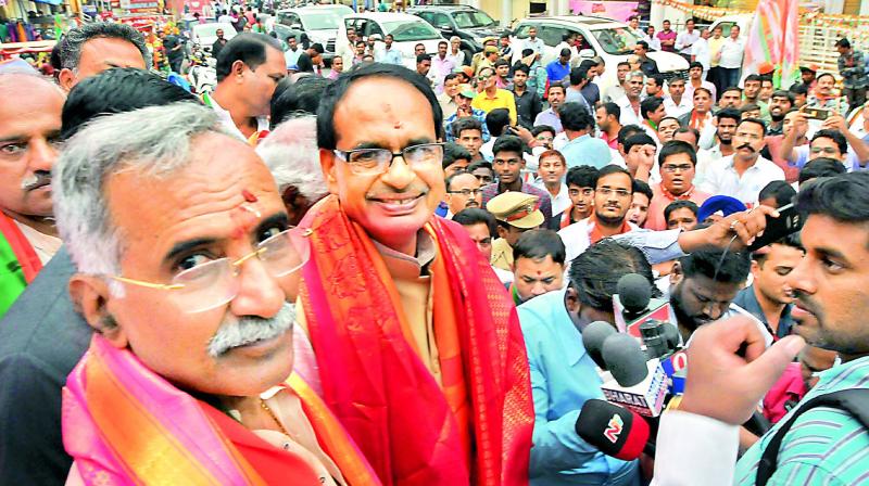 Madhya Pradesh Chief Minister Shivraj Singh Chouhan addresses a public meeting along with BJP candidate Banwari Lal at Ameerpet on Tuesday. — P. Surendra Madhya Pradesh Chief Minister Shivraj Singh Chouhan addresses a public meeting along with BJP candidate Banwari Lal at Ameerpet on Tuesday. — P. Surendra