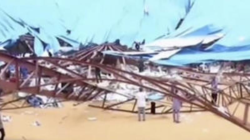 In this image taken from video people stand at the scene after the roof of The Reigners Bible Church International collapsed onto worshippers in Uyo, southern Nigeria. (Photo: AP) In this image taken from video people stand at the scene after the roof of The Reigners Bible Church International collapsed onto worshippers in Uyo, southern Nigeria. (Photo: AP)