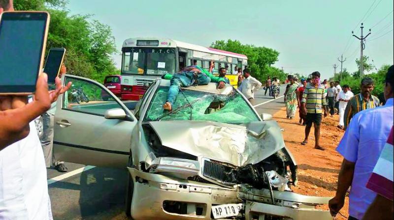The badly damaged car after the speeding bike landed on its windshield killing the passenger on the front seat. The badly damaged car after the speeding bike landed on its windshield killing the passenger on the front seat.