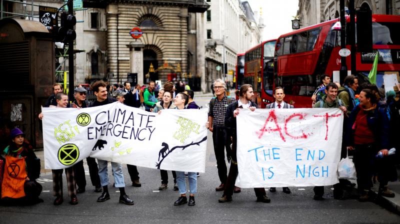 Extinction Rebellion climate change protesters held up banners as they briefly blocked the road near the Bank of England, in the City of London recently. Extinction Rebellion created blockades at various locations in the British capital for 10 days. (Photo: AP) Extinction Rebellion climate change protesters held up banners as they briefly blocked the road near the Bank of England, in the City of London recently. Extinction Rebellion created blockades at various locations in the British capital for 10 days. (Photo: AP)