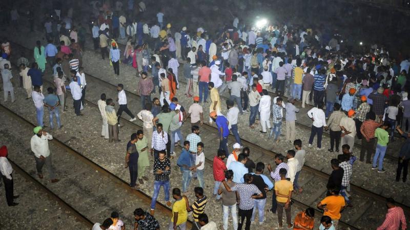 At least 61 people were killed and 72 injured Friday evening after a crowd of Dussehra revellers that had spilled onto railway tracks while watching burning of Ravana effigy was run over by a train near here, officials said. (Photo: PTI) At least 61 people were killed and 72 injured Friday evening after a crowd of Dussehra revellers that had spilled onto railway tracks while watching burning of Ravana effigy was run over by a train near here, officials said. (Photo: PTI)
