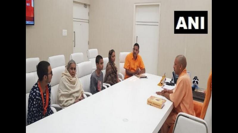 'We demanded capital punishment for the murderers. He (Adityanath) assured us that they will be punished,' Kiran Tiwari, the victim's wife, said. (Photo: ANI) 'We demanded capital punishment for the murderers. He (Adityanath) assured us that they will be punished,' Kiran Tiwari, the victim's wife, said. (Photo: ANI)