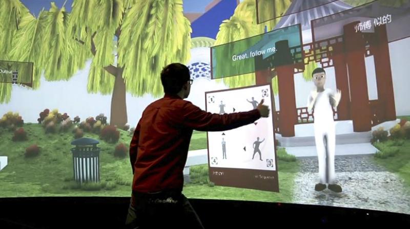 Rensselaer Polytechnic Institute graduate student Xiangyang Mou practices tai chi with an avatar in a campus studio at Rensselaer Polytechnic Institute in Troy, NY. The “Mandarin Project” is a joint venture of RPI and IBM. (AP Photo/Michael Hill) Rensselaer Polytechnic Institute graduate student Xiangyang Mou practices tai chi with an avatar in a campus studio at Rensselaer Polytechnic Institute in Troy, NY. The “Mandarin Project” is a joint venture of RPI and IBM. (AP Photo/Michael Hill)