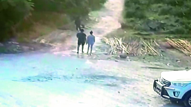 A CCTV screengrab, which was captured near the spot where Chandini’s body was found, shows her walking with an unidentified boy. (Photo:DC) A CCTV screengrab, which was captured near the spot where Chandini’s body was found, shows her walking with an unidentified boy. (Photo:DC)