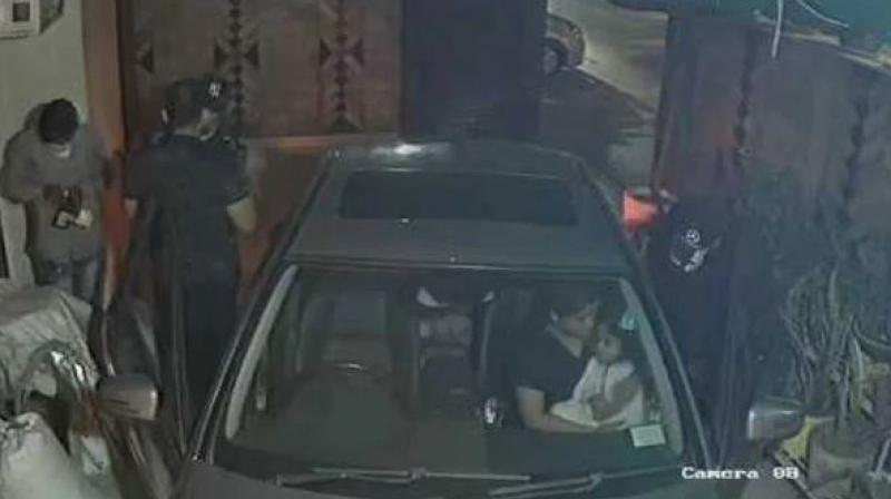 In the video, Bahl was seen stepping out of his Mercedes and running to close the gate when the three men barge inside, pointing a gun at him. (Photo: Screengrab) In the video, Bahl was seen stepping out of his Mercedes and running to close the gate when the three men barge inside, pointing a gun at him. (Photo: Screengrab)