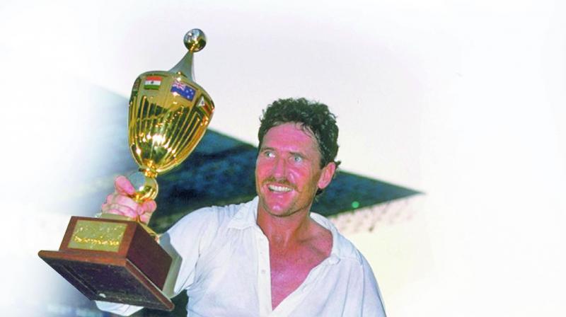 Australia skipper Allan Border celebrates, holding the 1987 World Cup. Australia skipper Allan Border celebrates, holding the 1987 World Cup.