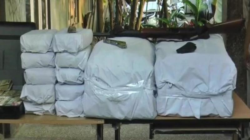 The team also recovered one 0.32 NPB Pistol with 21 rounds, one SBBL Rifle, two gun license books and eight bank passbooks. (Photo: ANI) The team also recovered one 0.32 NPB Pistol with 21 rounds, one SBBL Rifle, two gun license books and eight bank passbooks. (Photo: ANI)