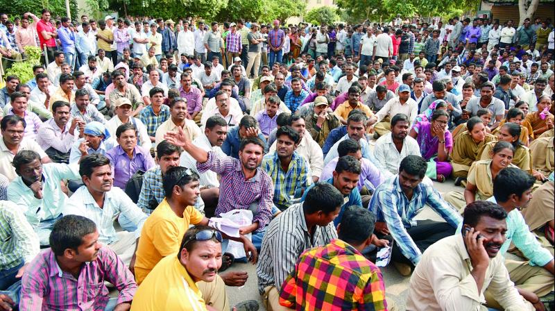 Homeguards stage a protest at the Gandhi Hospital on Tuesday in Hyderabad asking the government to grant their demands. (Photo: DC) Homeguards stage a protest at the Gandhi Hospital on Tuesday in Hyderabad asking the government to grant their demands. (Photo: DC)