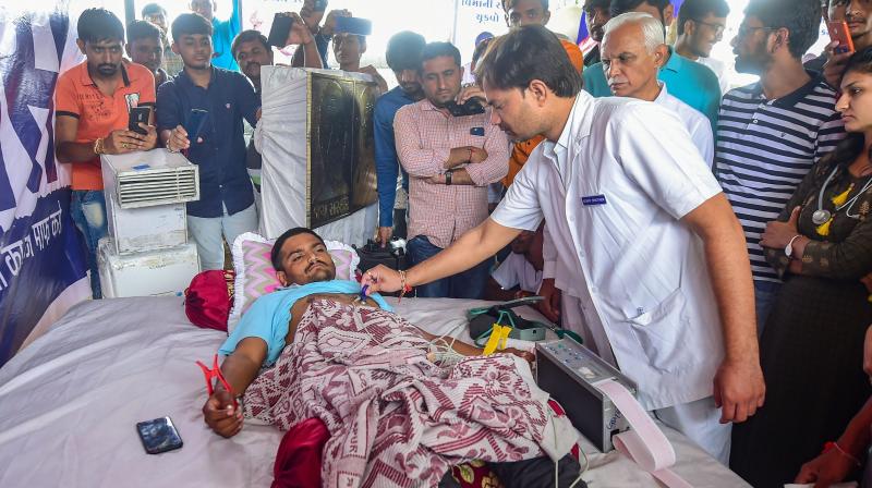 Hardik went on the indefinite fast on August 25 demanding reservations in government jobs and education for the Patidar community and waiver of farm loans. (Photo: PTI) Hardik went on the indefinite fast on August 25 demanding reservations in government jobs and education for the Patidar community and waiver of farm loans. (Photo: PTI)