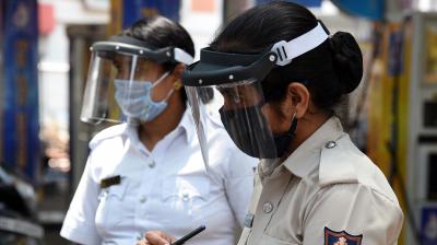 Police personal wearing covered visor masks during the Covid 19 panademic threat in Bengaluru on Saturday. (Photo: Satish.B)