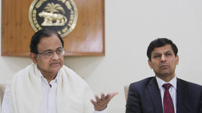 The Centre said it will take action against the people, hinting at former RBI governor Raghuram Rajan (R) and ex-finance minister P Chidambaram (L) at the time who relaxed gold import norms for private trading houses during the dying days of the UPA regime which resulted in a windfall of Rs 4,500 crore to 13 such entities in just six months. (Photo: PTI) The Centre said it will take action against the people, hinting at former RBI governor Raghuram Rajan (R) and ex-finance minister P Chidambaram (L) at the time who relaxed gold import norms for private trading houses during the dying days of the UPA regime which resulted in a windfall of Rs 4,500 crore to 13 such entities in just six months. (Photo: PTI)