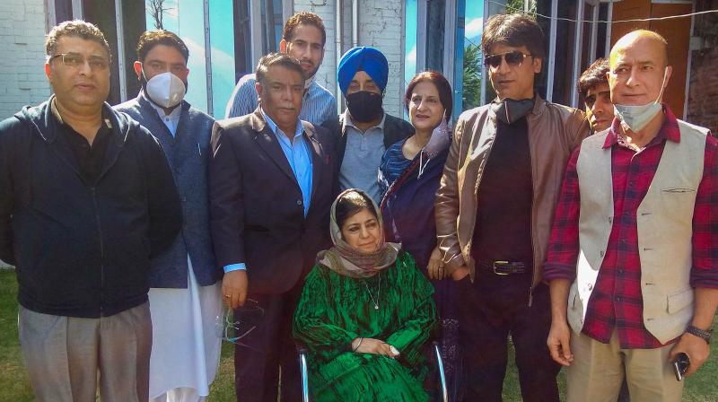 Former Chief Minister of Jammu and Kashmir and President of Peoples Democratic Party (PDP) Mehbooba Mufti poses for a photograph with senior party leaders, at her residence in Srinagar, Wednesday, Oct. 14, 2020. Union Territory administration revoked the Public Safety Act charges against Mufti, more than a year after she was detained following the abrogation of the special status of the erstwhile state. (PTI)