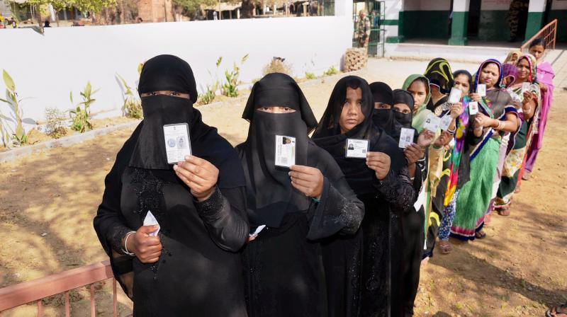 Muslim women line up at a polling station in Mirzapur to cast their votes during the seventh and final phase of the Uttar Pradesh Assembly elections. (Photo: PTI) Muslim women line up at a polling station in Mirzapur to cast their votes during the seventh and final phase of the Uttar Pradesh Assembly elections. (Photo: PTI)