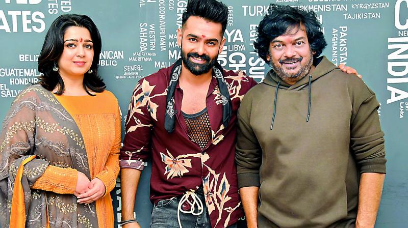 Charmee and Puri Jagannath with Ram at the launch. Charmee and Puri Jagannath with Ram at the launch.