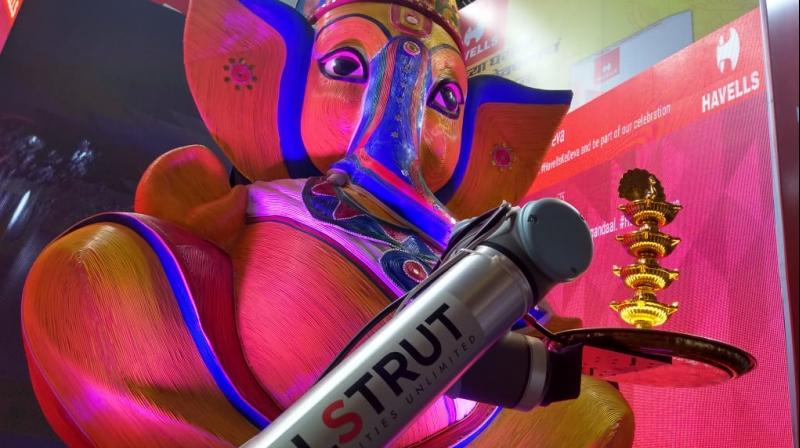 Robotic arms perform the Aarti while the pujaari is free to help with other duties. Robotic arms perform the Aarti while the pujaari is free to help with other duties.