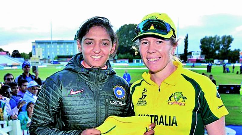 Australia’s Alex Blackwell (right) presents a jersey to India’s Harmanpreet after the World Cup semifinal on Thursday. Australia’s Alex Blackwell (right) presents a jersey to India’s Harmanpreet after the World Cup semifinal on Thursday.