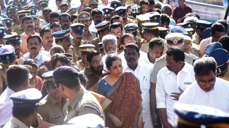 Union defence minister Nirmala Sitharaman proceeds to address fishing community at Vizhinjam on Monday. (Photo: Peethambaran Payyeri) Union defence minister Nirmala Sitharaman proceeds to address fishing community at Vizhinjam on Monday. (Photo: Peethambaran Payyeri)