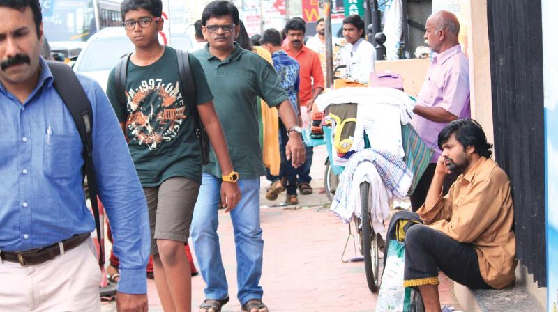 Anumuthu Chinnaraj (far right) on a street in Thiruvananthapuram. Anumuthu Chinnaraj (far right) on a street in Thiruvananthapuram.