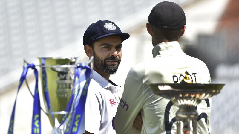 India captain Virat Kohli speaks to England captain Joe Root prior to the first Test Match between England and India at Trent Bridge cricket ground in Nottingham on Monday. (Photo: AP)