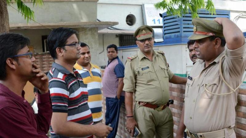 Family members of Karnataka Cadre IAS officer Anurag Tiwari wait outside a morgue to receive his body in Lucknow. (Photo: PTI) Family members of Karnataka Cadre IAS officer Anurag Tiwari wait outside a morgue to receive his body in Lucknow. (Photo: PTI)