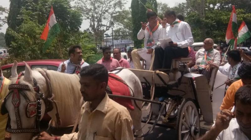 Goa Pradesh Congress Committee chief Girish Chodankar, Leader of Opposition in state Assembly Chandrakant Kavlekar, former CM Digambar Kamat, Congress legislative party spokesman Aleixo Reginaldo Lourenco were some of the leaders who took a ride in the carriage. (Photo: Twitter | @INCGoa) Goa Pradesh Congress Committee chief Girish Chodankar, Leader of Opposition in state Assembly Chandrakant Kavlekar, former CM Digambar Kamat, Congress legislative party spokesman Aleixo Reginaldo Lourenco were some of the leaders who took a ride in the carriage. (Photo: Twitter | @INCGoa)