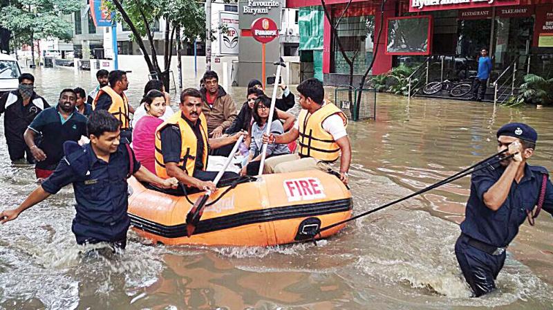 With people stranded, rubber boats were called in to ferry the marooned to safety while fire safety vehicles were seen in the basements of office blocks, pumping out water laced with kerosene that posed a huge fire safety hazard. With people stranded, rubber boats were called in to ferry the marooned to safety while fire safety vehicles were seen in the basements of office blocks, pumping out water laced with kerosene that posed a huge fire safety hazard.