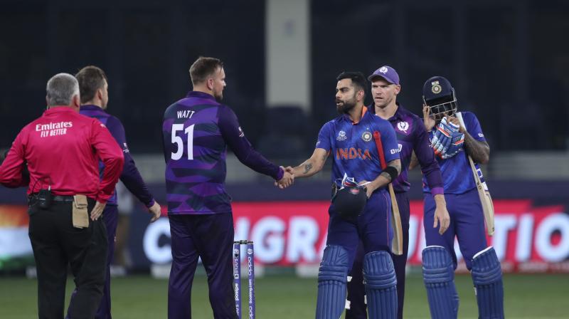 ndias captain Virat Kohli greets Scotlands players after India won the Cricket Twenty20 World Cup match between India and Scotland in Dubai, UAE, Friday, Nov. 5, 2021.(AP)