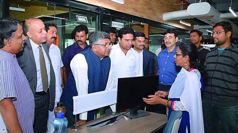 Union minister Ravi Shankar Prasad and TS minister K.T. Rama Rao interact with a staffer at the T-Hub in Gachibowli, Hyderabad, on Saturday. (Photo: DC) Union minister Ravi Shankar Prasad and TS minister K.T. Rama Rao interact with a staffer at the T-Hub in Gachibowli, Hyderabad, on Saturday. (Photo: DC)