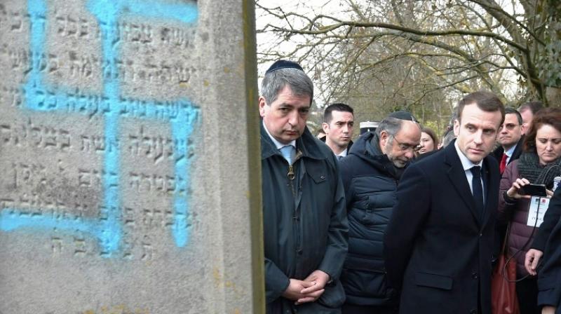 Macron's visit to the Jewish cemetery in the Alsace region, near Germany, where 96 Jewish tombstones were daubed with swastikas. (Photo: AFP) Macron's visit to the Jewish cemetery in the Alsace region, near Germany, where 96 Jewish tombstones were daubed with swastikas. (Photo: AFP)