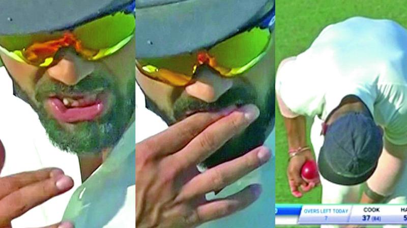 English tabloid Dailymail claims that footage has emerged of Virat Kohli appearing to shine the ball using residue from a sweet during the first Test at Rajkot. (Photo: Screengrab) English tabloid Dailymail claims that footage has emerged of Virat Kohli appearing to shine the ball using residue from a sweet during the first Test at Rajkot. (Photo: Screengrab)