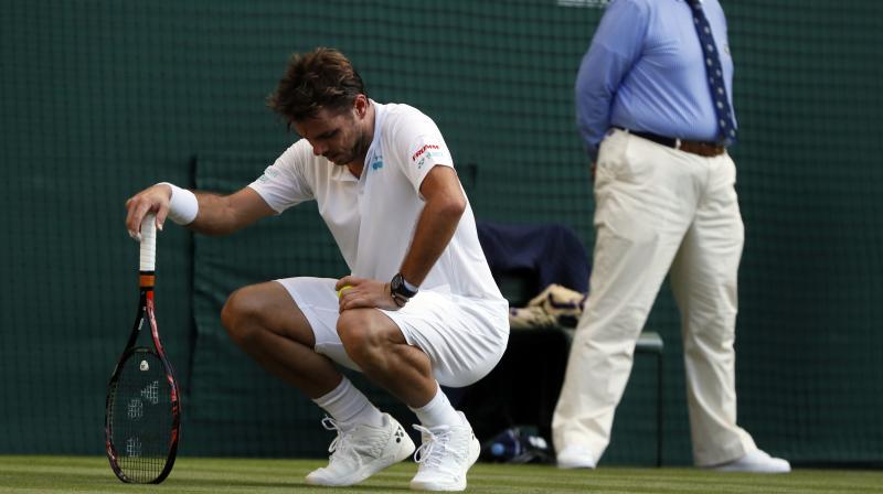 Wawrinka iced his knee during changeovers and never was able to summon his best tennis. (Photo: AP) Wawrinka iced his knee during changeovers and never was able to summon his best tennis. (Photo: AP)
