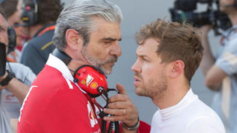 Ferrari chief Maurizio Arrivabene, left, talks with Ferrari driver Sebastian Vettel of Germany during a temporary halt at the Formula One Azerbaijan Grand Prix in Baku. (Photo: AP) Ferrari chief Maurizio Arrivabene, left, talks with Ferrari driver Sebastian Vettel of Germany during a temporary halt at the Formula One Azerbaijan Grand Prix in Baku. (Photo: AP)