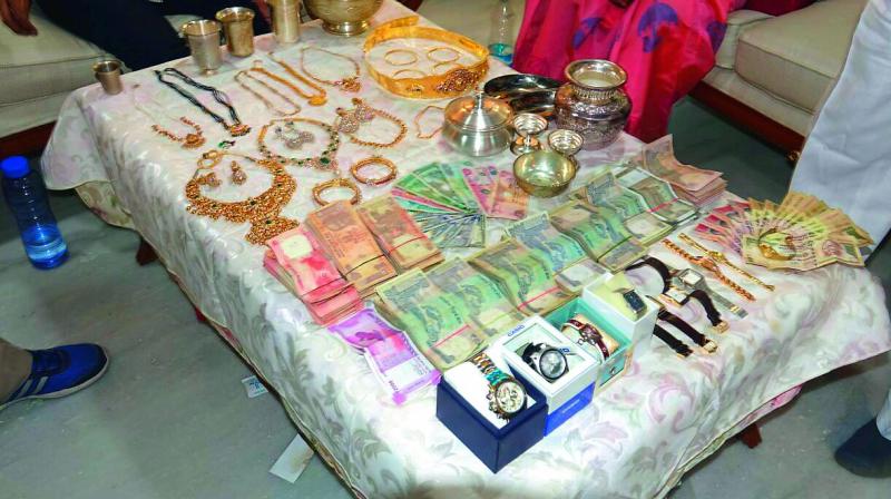 It rained gold, silver and diamonds – literally - at the house of suspended HMDA (planning) director, K. Purushotham Reddy on Sunday. 