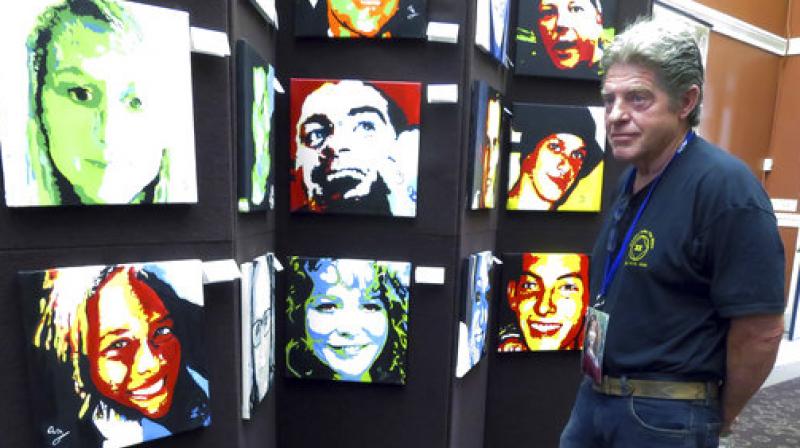 In this Thursday, Aug. 10, 2017 photo, Joe Fitzpatrick looks at a portrait of his daughter, Molly, who died of a drug overdose in 2015, as he attends a reception for artist Anne Marie Zanfagna at the New Hampshire State Library in Concord, N.H. (Photo: AP) In this Thursday, Aug. 10, 2017 photo, Joe Fitzpatrick looks at a portrait of his daughter, Molly, who died of a drug overdose in 2015, as he attends a reception for artist Anne Marie Zanfagna at the New Hampshire State Library in Concord, N.H. (Photo: AP)