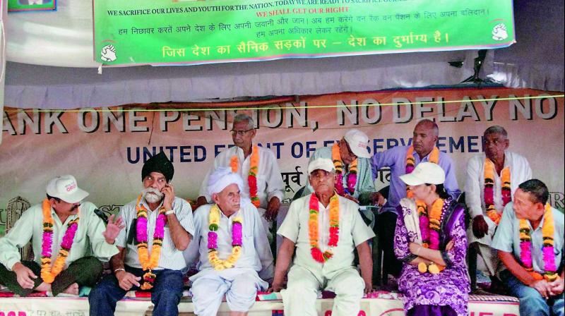 Ex-servicemen protesting over the issue of one rank one pension scheme at Jantar Mantar in New Delhi on Wednesday. (Photo: PTI) Ex-servicemen protesting over the issue of one rank one pension scheme at Jantar Mantar in New Delhi on Wednesday. (Photo: PTI)