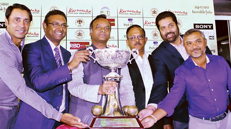 (Left to right) Golfer Jyoti Randhawa, Sandeep Madhavan, President, KGA, Priyank Kharge, Minister for Tourism, Gaurav Gupta, Principal Secretary, Uttam Singh Mundy, CEO, PGTI and golfer Rahil Gangjee unveil the trophy on Tuesday (Photo: R. SAMUEL) (Left to right) Golfer Jyoti Randhawa, Sandeep Madhavan, President, KGA, Priyank Kharge, Minister for Tourism, Gaurav Gupta, Principal Secretary, Uttam Singh Mundy, CEO, PGTI and golfer Rahil Gangjee unveil the trophy on Tuesday (Photo: R. SAMUEL)