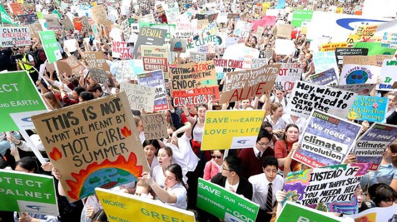 Large-scale agitations first started in Australia on Friday, setting things in motion with close to 3,00,000 people coming out on the streets in 'the land Down Under' for the cause of global warming. (Photo: AP) Large-scale agitations first started in Australia on Friday, setting things in motion with close to 3,00,000 people coming out on the streets in 'the land Down Under' for the cause of global warming. (Photo: AP)