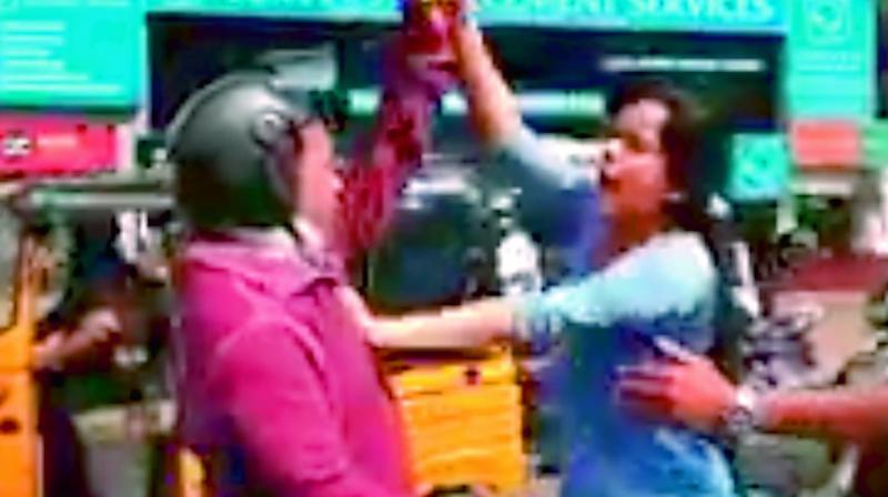 An angry Lubna assaulting a biker in Begumpet on Thursday. An angry Lubna assaulting a biker in Begumpet on Thursday.