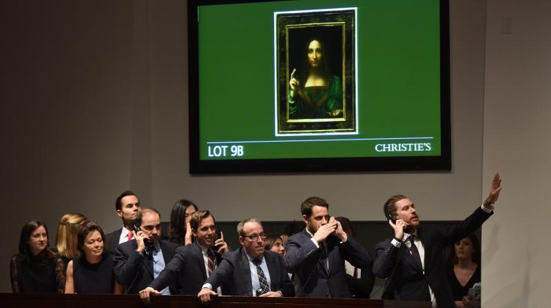 Christie's employees take bids for Leonardo da Vinci’s "Salvator Mundi" during the Post-War & Contemporary Art Evening Sale at Christie's New York November 15, 2017. (Photo: AFP) Christie's employees take bids for Leonardo da Vinci’s "Salvator Mundi" during the Post-War & Contemporary Art Evening Sale at Christie's New York November 15, 2017. (Photo: AFP)