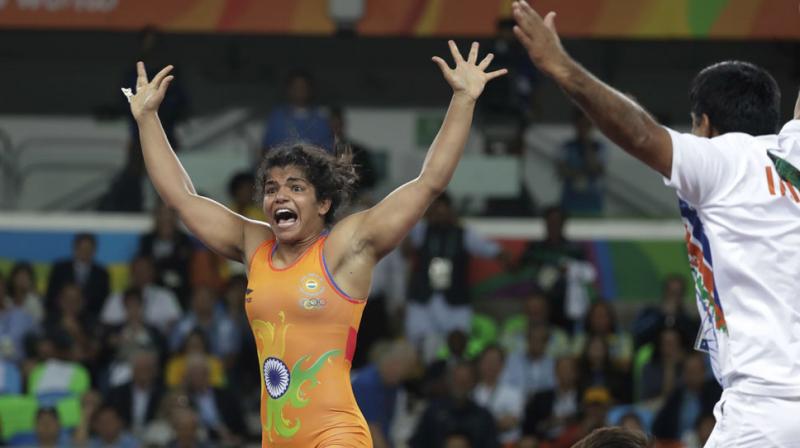 Fighting back from 0-5 down to beat Aisuluu Tynybekova of Kyrgyzstan 8-5 in the dying minutes of the bronze medal play-off match in women's 58kg freestyle, Sakshi Malik ended India's painful wait at the 2016 Rio Olympics for a medal. (Photo: AP) Fighting back from 0-5 down to beat Aisuluu Tynybekova of Kyrgyzstan 8-5 in the dying minutes of the bronze medal play-off match in women's 58kg freestyle, Sakshi Malik ended India's painful wait at the 2016 Rio Olympics for a medal. (Photo: AP)