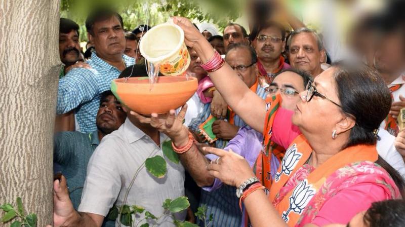 CM Raje also launched a drinking water kiosk that carries a BJP banner with a picture of its election symbol. (Photo: @VasundharaBJP/Twitter) CM Raje also launched a drinking water kiosk that carries a BJP banner with a picture of its election symbol. (Photo: @VasundharaBJP/Twitter)