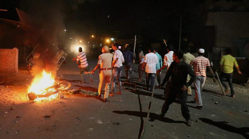 Rioters hurl stones and sticks during a communal riot that escalated due to clamping illegal water connection in a religious place in Moti Karanja area of Aurangabad on Friday night. (Photo: PTI) Rioters hurl stones and sticks during a communal riot that escalated due to clamping illegal water connection in a religious place in Moti Karanja area of Aurangabad on Friday night. (Photo: PTI)