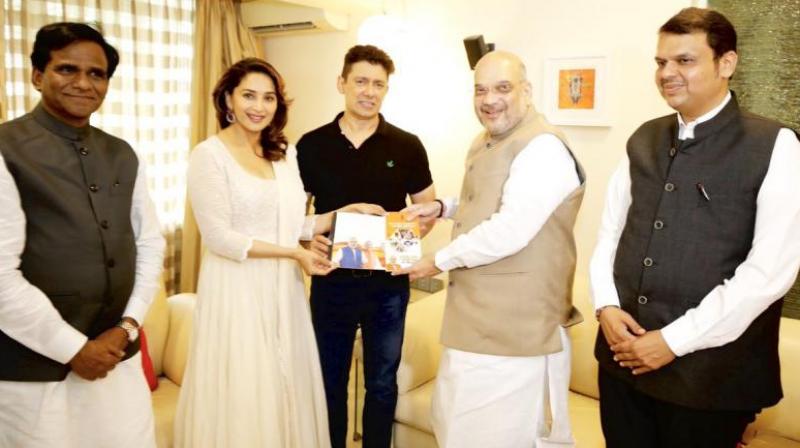 51-year-old actor, Madhuri Dixit has featured in many Bollywood films, including ‘Hum Aapke Hain Koun..!’, ‘Dil To Pagal Hai’, ‘Saajan’ and ‘Devdas’. (Photo: Twitter | @AmitShah) 51-year-old actor, Madhuri Dixit has featured in many Bollywood films, including ‘Hum Aapke Hain Koun..!’, ‘Dil To Pagal Hai’, ‘Saajan’ and ‘Devdas’. (Photo: Twitter | @AmitShah)
