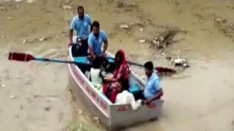 The water level swells following the release of 1.43 lakh cusec water from Haryana. (Photo: ANI) The water level swells following the release of 1.43 lakh cusec water from Haryana. (Photo: ANI)