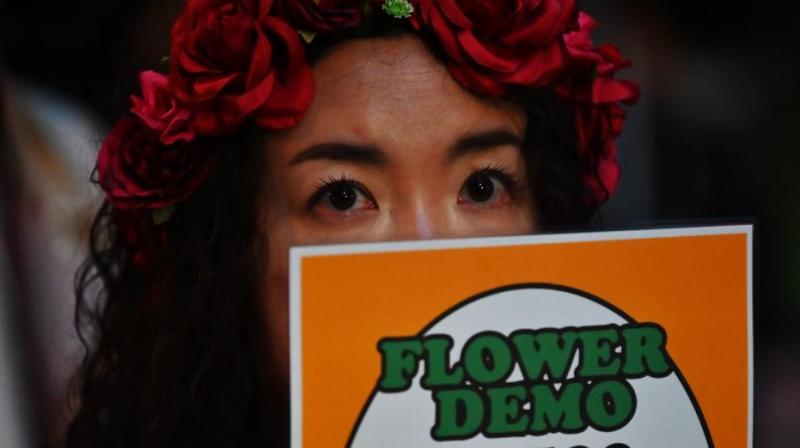 A demonstrator holds a placard during a protest against the lack of substantial legal protection for sexual assault victims in Tokyo on June 11, 2019. (Photo: AFP) A demonstrator holds a placard during a protest against the lack of substantial legal protection for sexual assault victims in Tokyo on June 11, 2019. (Photo: AFP)
