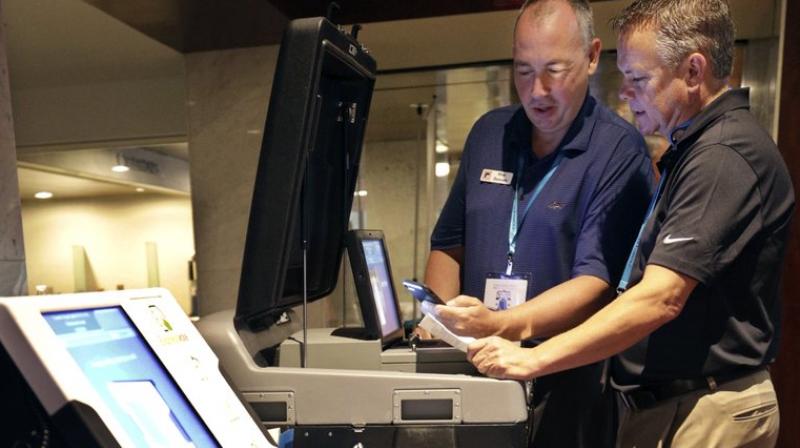 In much of the nation, especially where tech expertise and budgets are thin, the companies effectively run elections either directly or through subcontractors. (Photo: AP) In much of the nation, especially where tech expertise and budgets are thin, the companies effectively run elections either directly or through subcontractors. (Photo: AP)