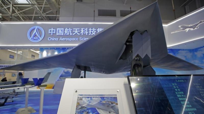 The CH-7′s chief designer Shi Wen says the aircraft can “fly long hours, scout and strike the target when necessary.” (AP Photo/Kin Cheung) The CH-7′s chief designer Shi Wen says the aircraft can “fly long hours, scout and strike the target when necessary.” (AP Photo/Kin Cheung)